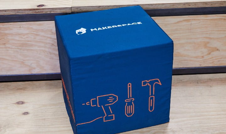 A cube with Makerspace logos