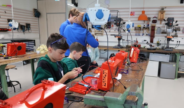 Students working at a technical workshop
