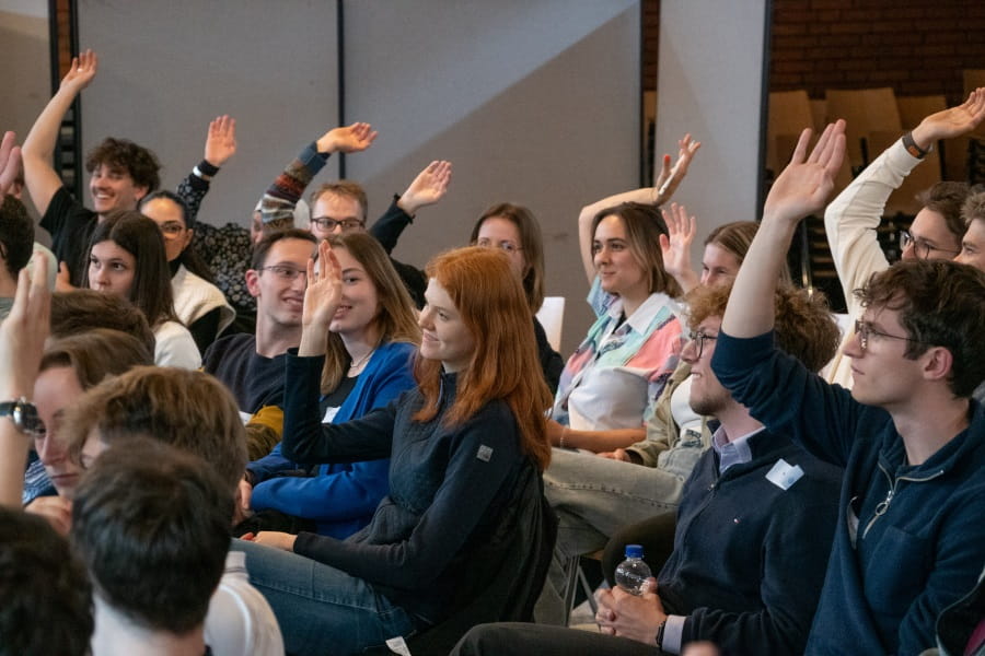 A group of young adults participating in a discussion forum
