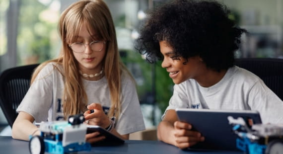 Kids with tablets coding